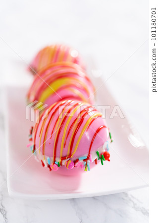 Christmas hot chocolate bombs on a white plate. Christmas hot chocolate bombs on a white plate. 101180701