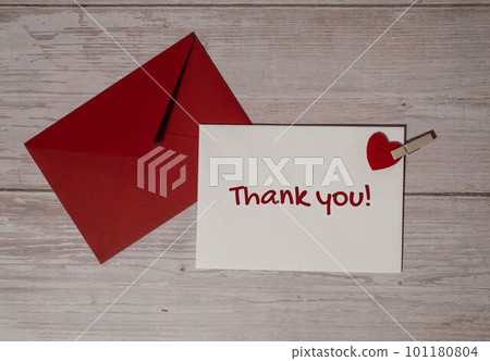 THANK YOU text on valentine card inscription positive quote phrase Greeting card with red envelope on wooden background. Romantic Small hearts Valentine day. Holiday morning 101180804