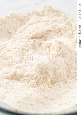 Mixing bread dough in a stand-alone kitchen mixer to bake patriotic cinnamon twists. Mixing bread dough in a stand-alone kitchen mixer to bake patriotic cinnamon twists. 101181093