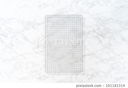 Empty baking drying rack on a marble surface. Empty baking drying rack on a marble surface. 101181314