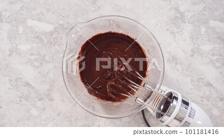 Flat lay. Step by step. Mixing ingredients to bake unicorn rainbow chocolate cupcakes. Flat lay. Step by step. Mixing ingredients to bake unicorn rainbow chocolate cupcakes. 101181416