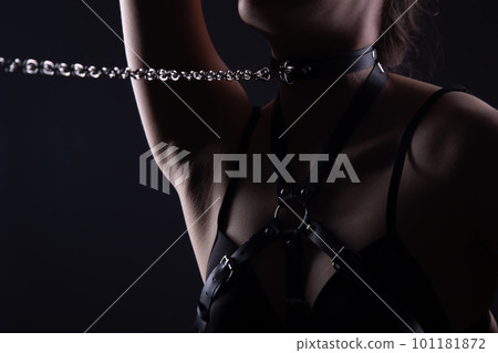 Image of womans neck in bandage belt with chain 101181872