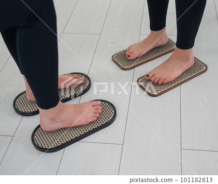 Caucasian and Asian women stand up sadhu boards together. Caucasian and Asian women stand up sadhu boards together. 101182813