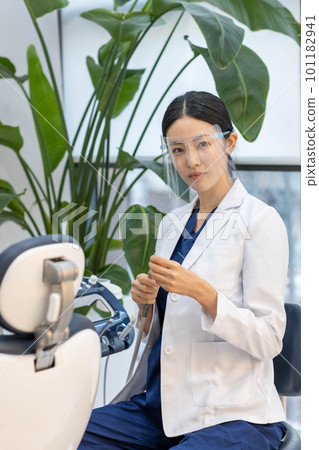 female scientist looking at the tube, dental,doctor dentist woring 101182941