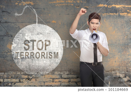 Businessman holding a megaphone with stop terrorism sign Businessman holding a megaphone with stop terrorism sign 101184669