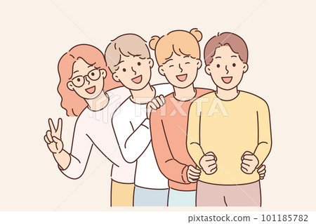 Pre-teenage children stand behind each other and laugh enjoying socializing together Pre-teenage children stand behind each other and laugh enjoying socializing together 101185782