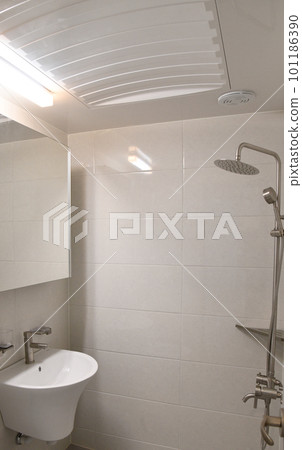 modern bathroom with shower and washbasin 101186390