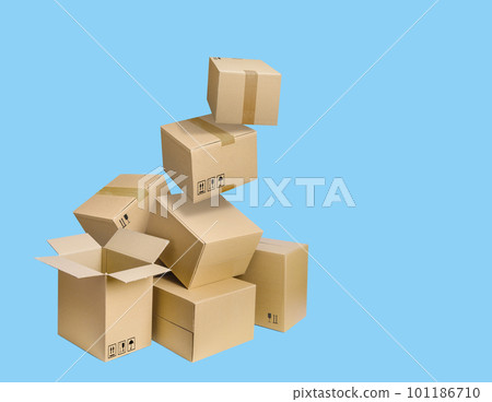 Cardboard parcel boxes falling on blue background 101186710