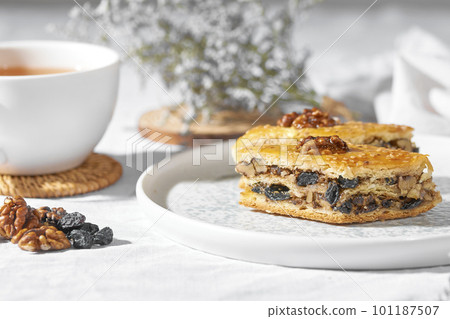 Sweet oriental dessert with nuts, raisins and honey. Sweet oriental dessert with nuts, raisins and honey. 101187507