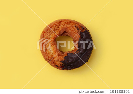 old fashioned donut chocolate yellow background 101188301