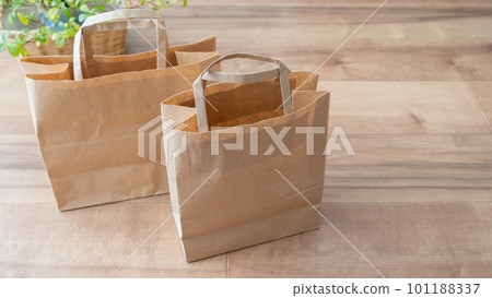 Brown paper bags and handbags placed on the floor Brown paper bags and handbags placed on the floor 101188337