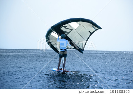 Man practicing kitesurf at the beach 101188365