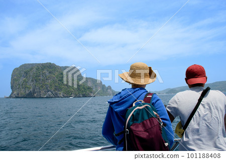 Friends watching the horizon views from a ferry boat Friends watching the horizon views from a ferry boat 101188408