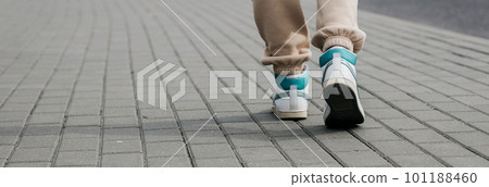 legs in sweatpants and sneakers 101188460