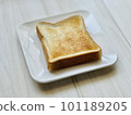 Bread on a white plate 101189205