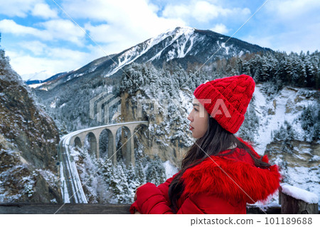 Tourist visiting Landwasser Viaduct world heritage in Swiss Alps snow winter scenery, Switzerland. Tourist visiting Landwasser Viaduct world heritage in Swiss Alps snow winter scenery, Switzerland. 101189688