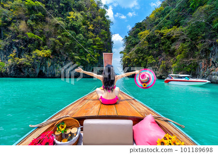 Beautiful girl in bikini on longtail boat at Koh hong island, Thailand. 101189698