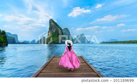 Tourist walking on wooden bridge in Phang nga bay, Thailand. 101189699