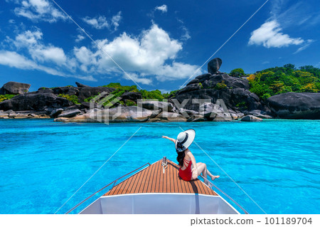 Female in bikini relaxing on yacht. Similan island in Thailand. 101189704