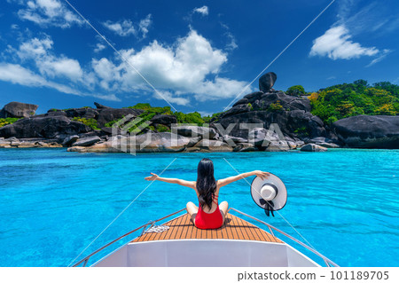 Female in bikini relaxing on yacht. Similan island in Thailand. 101189705