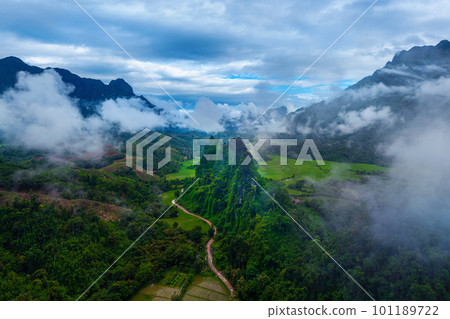 Limestone mountains covered by mist in Vang vieng, Laos. Limestone mountains covered by mist in Vang vieng, Laos. 101189722