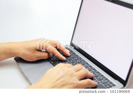 Male hands operating a laptop Male hands operating a laptop 101190069