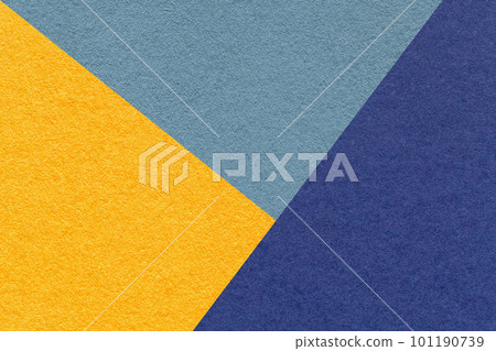 Texture of craft yellow, navy blue and denim shade color paper background, macro. Vintage abstract cardboard 101190739