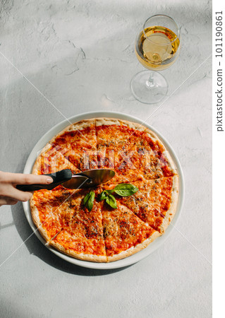Traditional Italian pizza, vegetables, ingredients on a light background.Pizza menu. View from above. Place for text. Traditional Italian pizza, vegetables, ingredients on a light background.Pizza menu. View from above. Place for text. 101190861