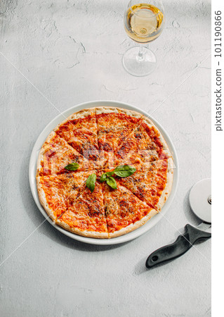 Traditional Italian pizza, vegetables, ingredients on a light background.Pizza menu. View from above. Place for text. Traditional Italian pizza, vegetables, ingredients on a light background.Pizza menu. View from above. Place for text. 101190866