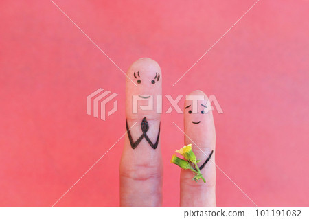 Fingers art of happy people. Concept of child gives his mother a flower. Mother's Day.  101191082