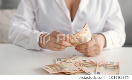 Cash payment. Budget expenses. Financial investment. Closeup of unrecognizable rich woman hands counting 50 bill Euro banknotes money. Cash payment. Budget expenses. Financial investment. Closeup of unrecognizable rich woman hands counting 50 bill Euro banknotes money. 101191875