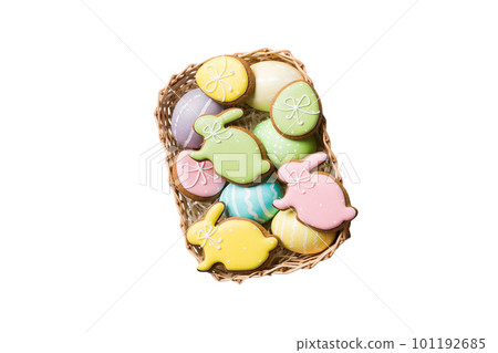 Colorful easter cookies in basket with Multi colors Easter eggs isolated on white background. Pastel color Easter eggs. holiday concept 101192685