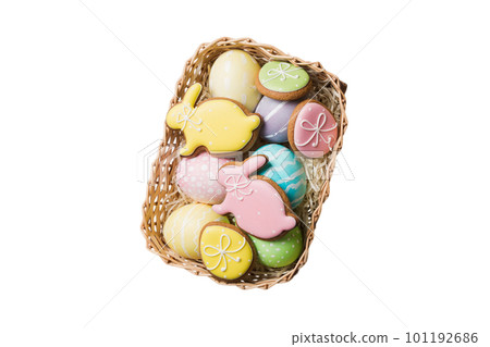 Colorful easter cookies in basket with Multi colors Easter eggs isolated on white background. Pastel color Easter eggs. holiday concept 101192686