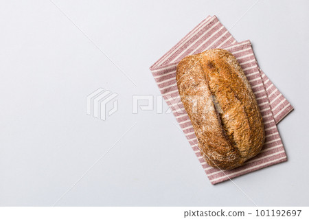 Fresh Homemade Whole Wheat Bread. bread on napkin on rustic background, fresh bread top view Fresh Homemade Whole Wheat Bread. bread on napkin on rustic background, fresh bread top view 101192697
