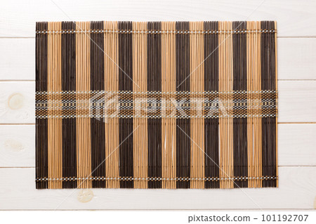 Top view of brown tablecloth for food on wooden background. Empty space for your design 101192707
