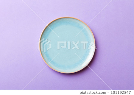 Top view of isolated of colored background empty round blue plate for food. Empty dish with space for your design Top view of isolated of colored background empty round blue plate for food. Empty dish with space for your design 101192847