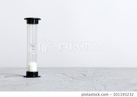 hourglass on the table, sand clock as time passing concept for business deadline, copy space hourglass on the table, sand clock as time passing concept for business deadline, copy space 101193232