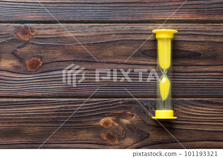 hourglass on the table, sand clock as time passing concept for business deadline, copy space hourglass on the table, sand clock as time passing concept for business deadline, copy space 101193321