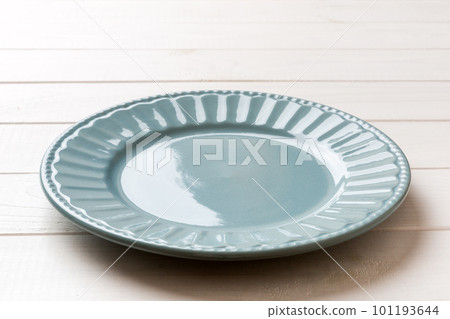 Perspective view of empty grey plate on cement background. Empty space for your design 101193644