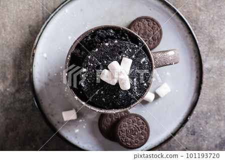 Close up of chocolate cake with marshmallows and powdered sugar for homemade dessert top view 101193720