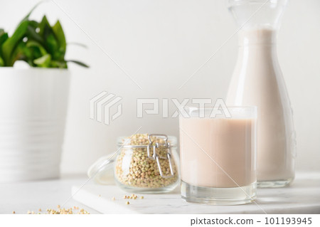 Vegan green buckwheat milk in glass, plant based milk replacer. 101193945