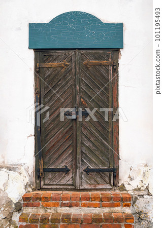 An old wooden door with a red bricks stairs An old wooden door with a red bricks stairs 101195493