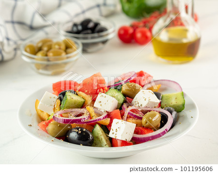 Greek salad on white table 101195606