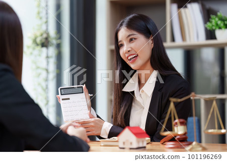 Close up Business people or Real Estate agent explain signing agreement for sale house to client. Property, Insurance, Broker concept Close up Business people or Real Estate agent explain signing agreement for sale house to client. Property, Insurance, Broker concept 101196269