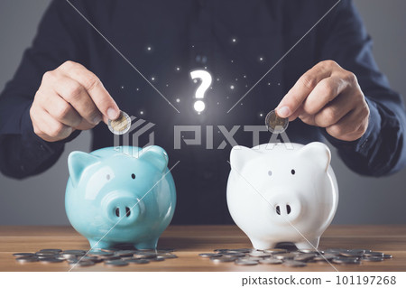 Money saving for future or Financial for retirement concept. Selective saving, Man adding coin to the two of piggy bank on coin stacked on the wooden table. Money plan for life idea. Money saving for future or Financial for retirement concept. Selective saving, Man adding coin to the two of piggy bank on coin stacked on the wooden table. Money plan for life idea. 101197268