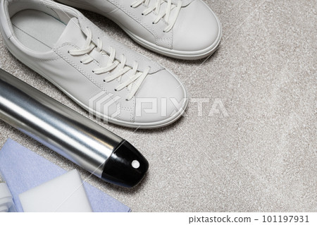 White leather shoe cleaning kit - water-repellent spray, foam, rag and sponge, copy space, place for text White leather shoe cleaning kit - water-repellent spray, foam, rag and sponge, copy space, place for text 101197931