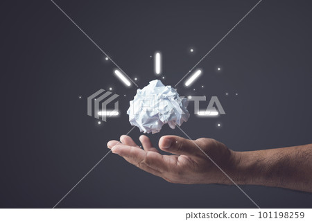 Brainstorm or create an idea, Trying to innovate of new think, The process of successful, Hand holding white used crumpled paper. Studi shot. Brainstorm or create an idea, Trying to innovate of new think, The process of successful, Hand holding white used crumpled paper. Studi shot. 101198259
