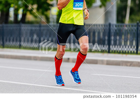 male runner in compression socks run marathon race 101198354