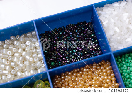 Colorful beads in containers close up, handicrafts Colorful beads in containers close up, handicrafts 101198372