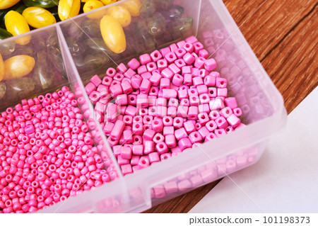 Colorful beads in containers close up, handicrafts Colorful beads in containers close up, handicrafts 101198373